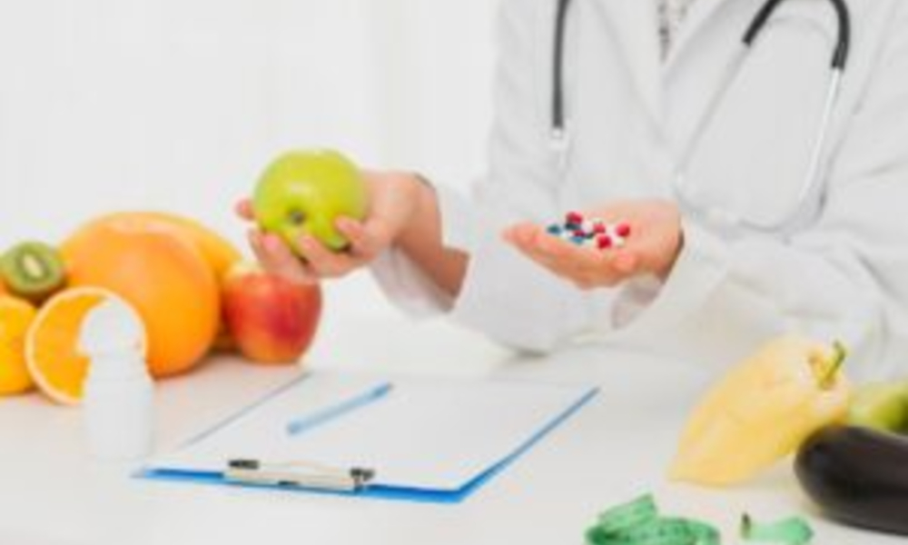 close up doctor with pills fresh fruits x