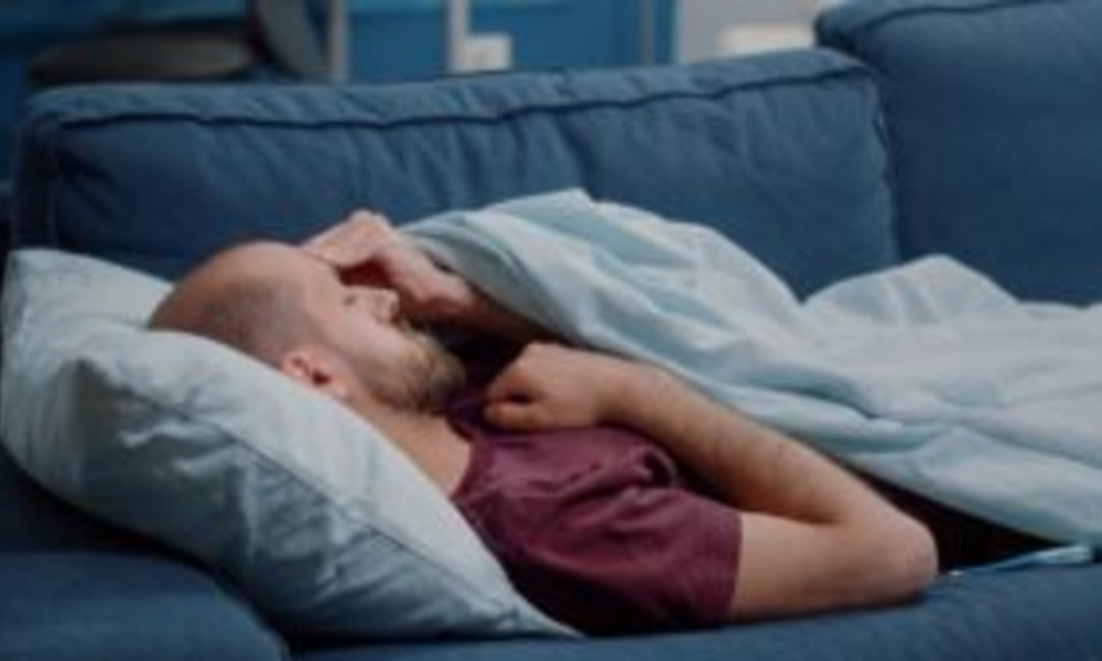 sick man looking thermometer check fever measurement while sleeping ill person holding medical instrument measuring temperature resting blanket unwell adult with illness x