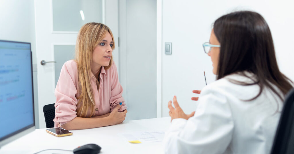 Woman discussing structured plan during medical weight loss guide consultation